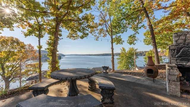 view of patio / terrace with a water view