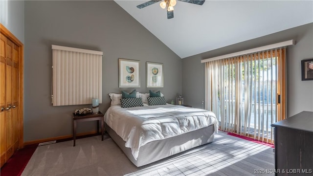 carpeted bedroom featuring ceiling fan, a closet, access to outside, and high vaulted ceiling