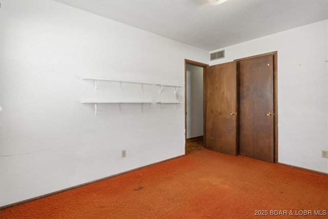 unfurnished bedroom with carpet