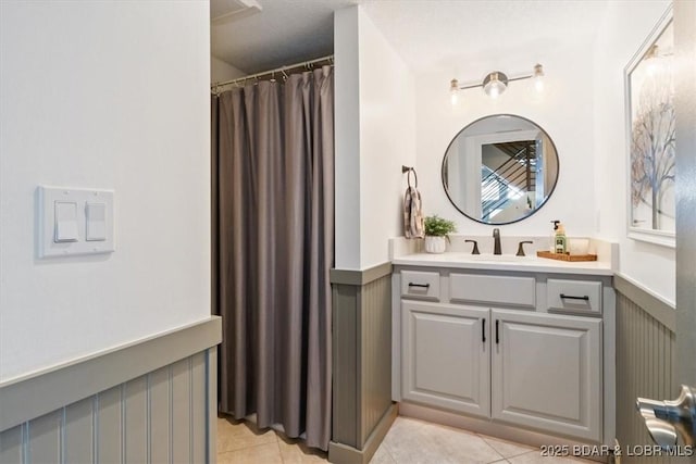 bathroom with tile patterned flooring and vanity