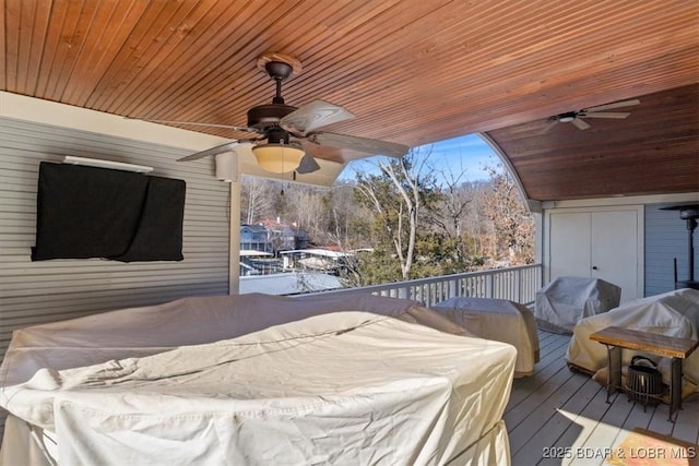 wooden deck featuring area for grilling and ceiling fan