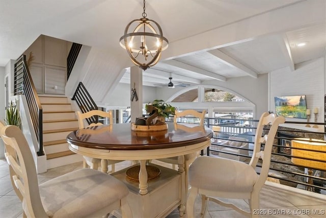 tiled dining room featuring ceiling fan with notable chandelier and beam ceiling