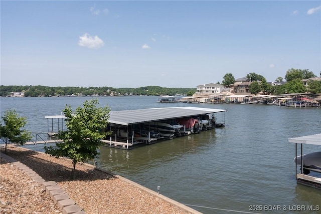 16 Hawk Harbor Ln Unit 2B, Lake Ozark, MO 65049 - dock area with boat lift and a water view