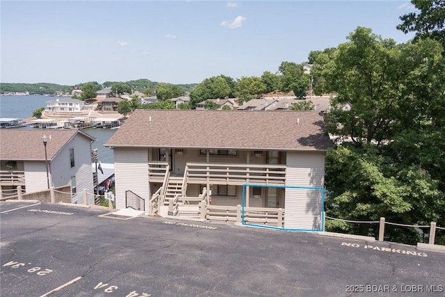 16 Hawk Harbor Ln Unit 2B, Lake Ozark, MO 65049 - view of front of house featuring uncovered parking and stairs