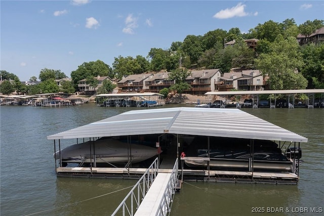 16 Hawk Harbor Ln Unit 2B, Lake Ozark, MO 65049 - dock with a water view and boat lift