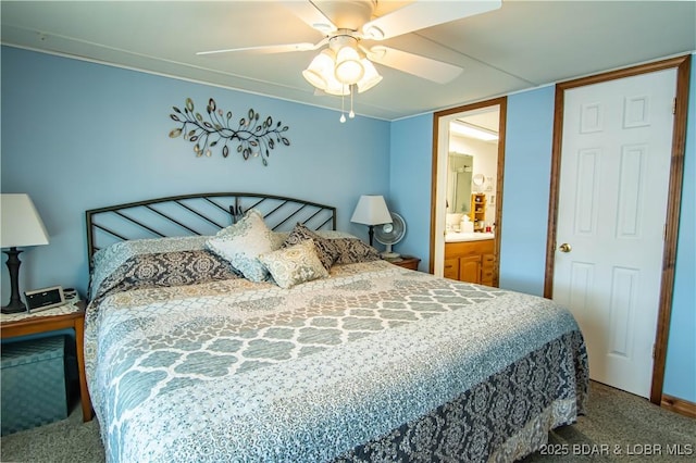 bedroom with ceiling fan, carpet, and ensuite bath