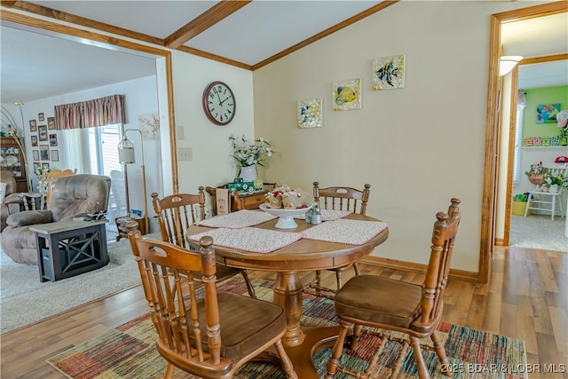 dining room featuring hardwood / wood-style floors and lofted ceiling