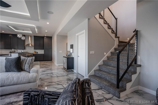 living room with a raised ceiling