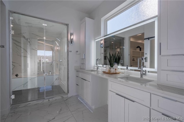 bathroom with walk in shower and vanity