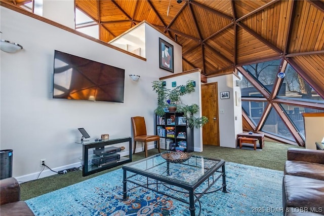 living room with wooden ceiling, carpet floors, and a towering ceiling