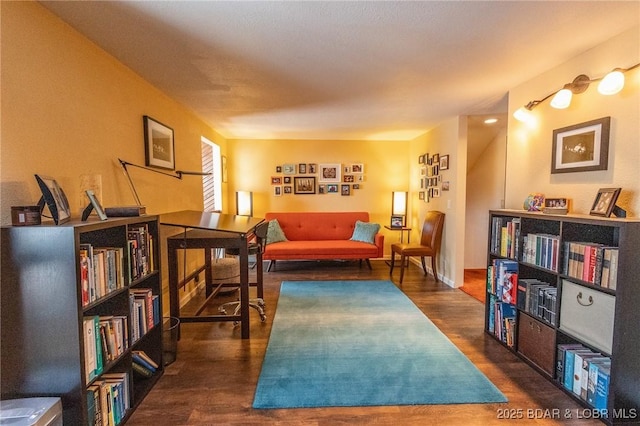 sitting room with dark hardwood / wood-style flooring