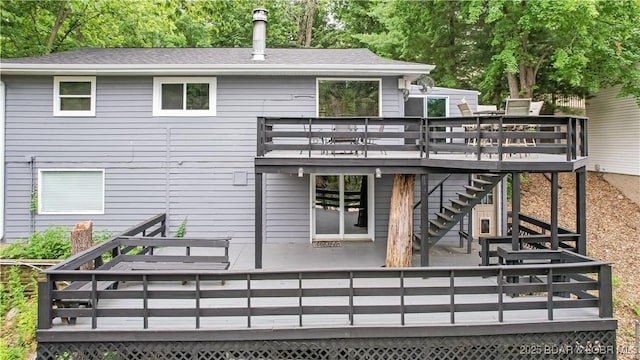 rear view of property with a deck