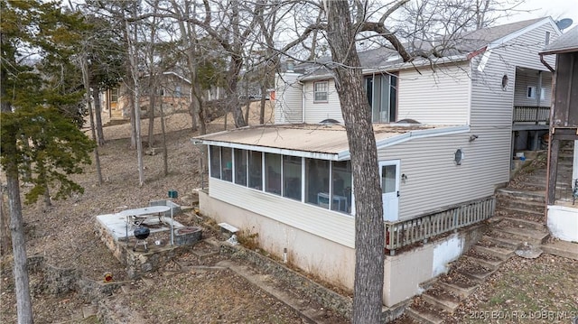 view of home's exterior featuring a sunroom