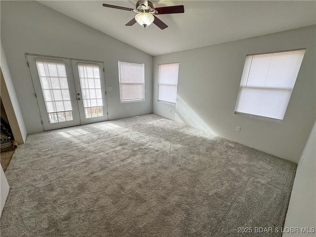 23731 Grant Rd, Barnett, MO 65011 - carpeted empty room with lofted ceiling, a ceiling fan, and french doors