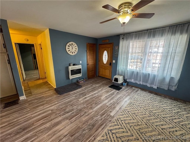 23731 Grant Rd, Barnett, MO 65011 - entrance foyer featuring heating unit, wood finished floors, and a ceiling fan