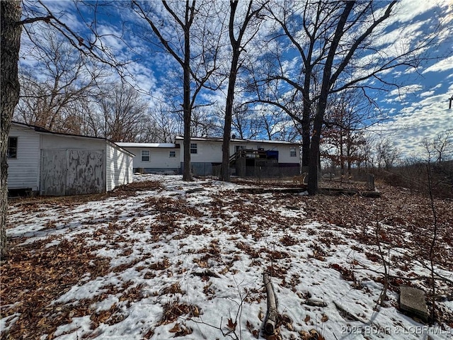 view of yard covered in snow