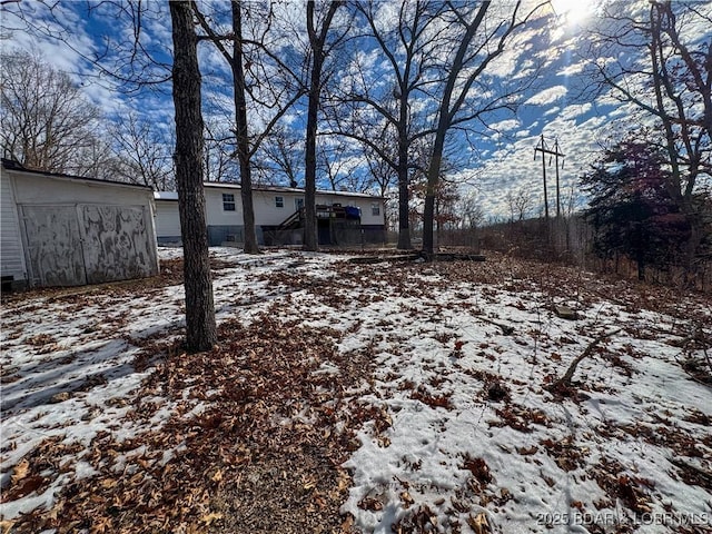 view of yard layered in snow