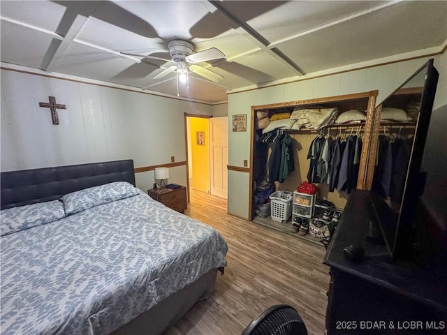 23731 Grant Rd, Barnett, MO 65011 - bedroom with wood finished floors, a closet, ceiling fan, and coffered ceiling