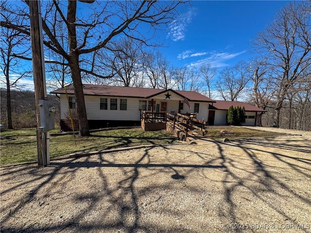 23731 Grant Rd, Barnett, MO 65011 - ranch-style house with a garage, driveway, and a front lawn