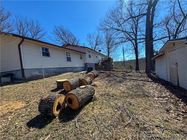 23731 Grant Rd, Barnett, MO 65011 - view of property exterior featuring a storage shed