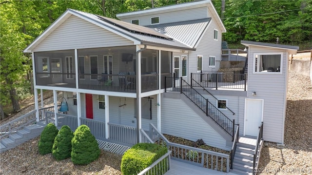 view of front of home with a sunroom