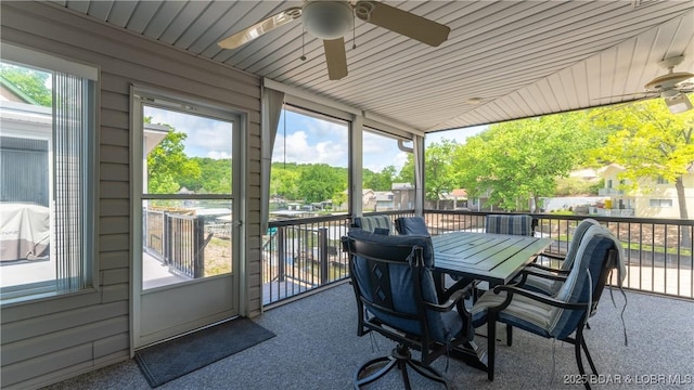 sunroom featuring ceiling fan