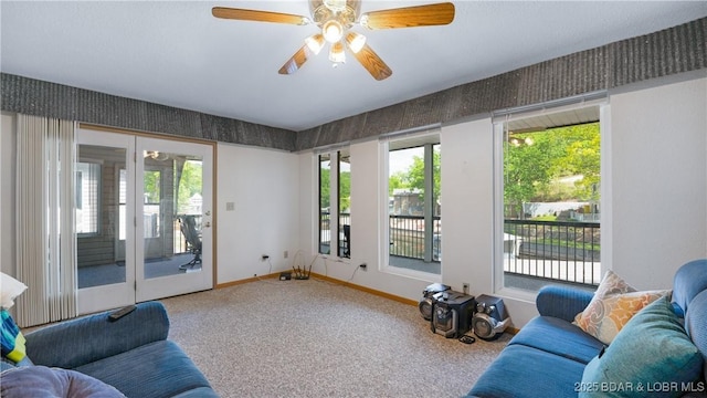 living room with carpet flooring and ceiling fan