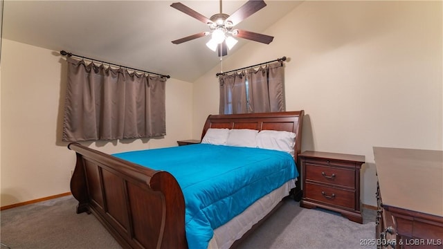 bedroom with ceiling fan, light colored carpet, and lofted ceiling