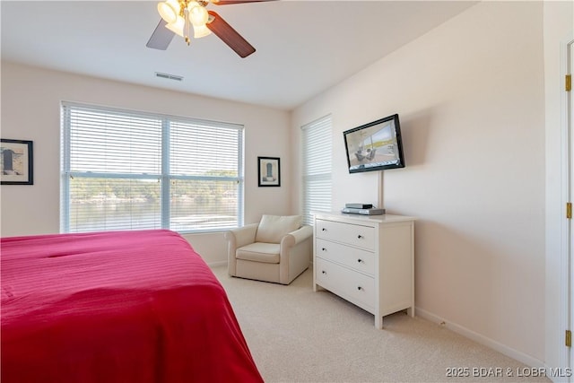 bedroom featuring ceiling fan and light carpet