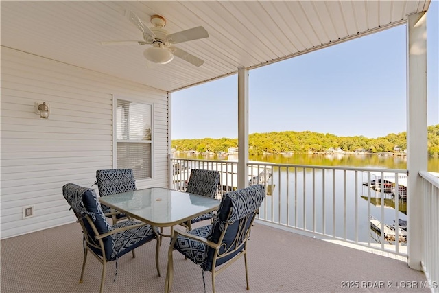 exterior space featuring a water view and ceiling fan