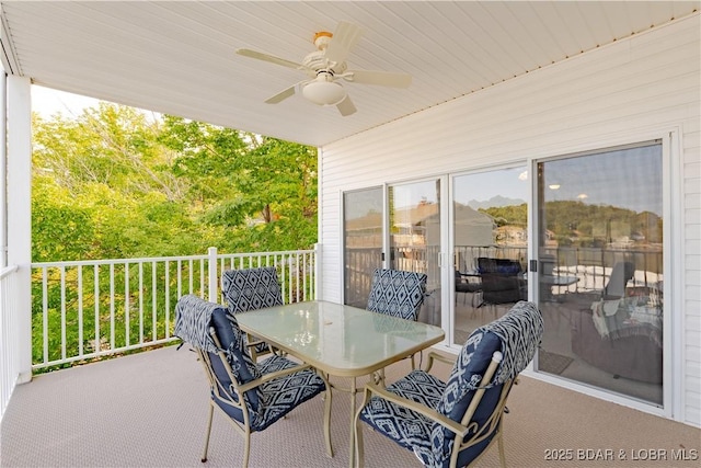 view of patio / terrace featuring ceiling fan and a balcony