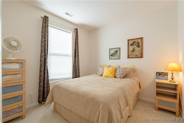 bedroom with light colored carpet