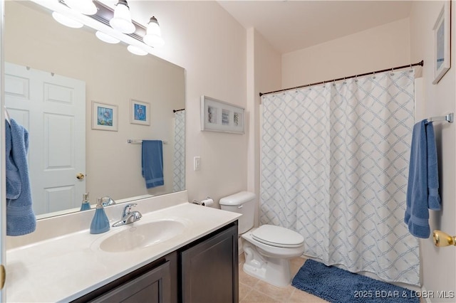 bathroom featuring tile patterned floors, toilet, vanity, and a chandelier