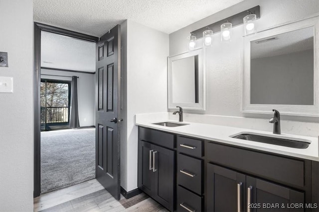 65 Laguna Dr Unit 1A/757, Lake Ozark, MO 65049 - full bath featuring a textured ceiling, wood finished floors, and double vanity
