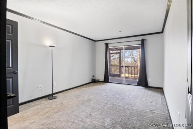 spare room with light carpet and crown molding