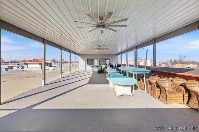 sunroom / solarium with ceiling fan