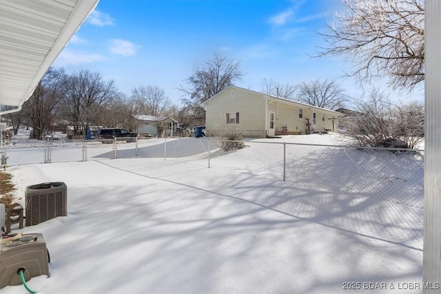 yard covered in snow with central AC unit