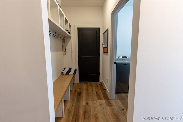 mudroom featuring light hardwood / wood-style flooring and washer / clothes dryer