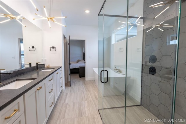 bathroom with vanity, a wealth of natural light, and an enclosed shower