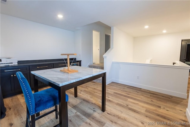 dining space with light wood-type flooring