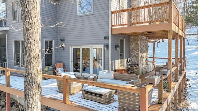 view of snow covered deck