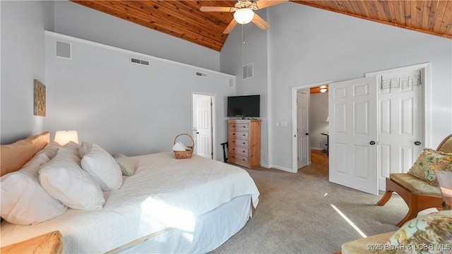 bedroom featuring ceiling fan, light colored carpet, wood ceiling, and high vaulted ceiling