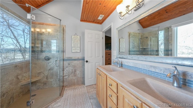 bathroom with vanity, wood ceiling, a shower with door, and tile patterned floors