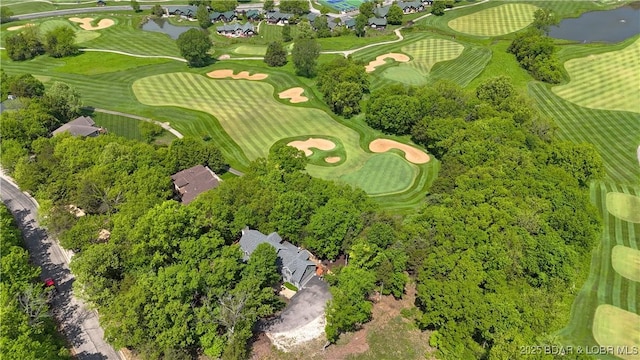 aerial view of property's location featuring a large body of water and a local golf course