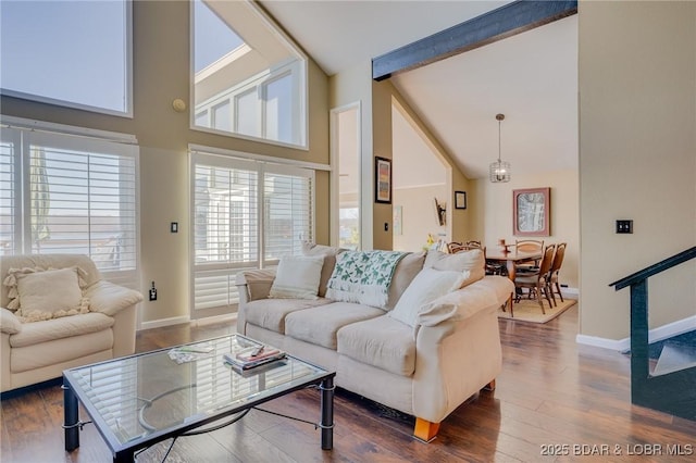 living room featuring high vaulted ceiling, dark hardwood / wood-style floors, and beam ceiling