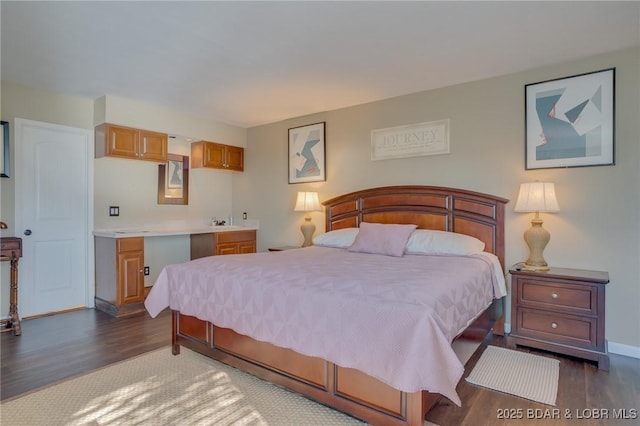 bedroom with dark hardwood / wood-style flooring