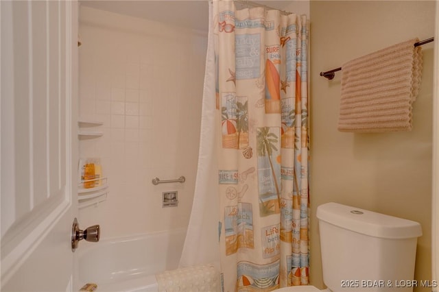 bathroom featuring toilet and shower / bath combination with curtain