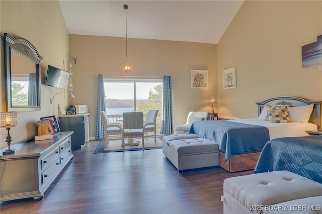 bedroom featuring vaulted ceiling and dark wood-type flooring