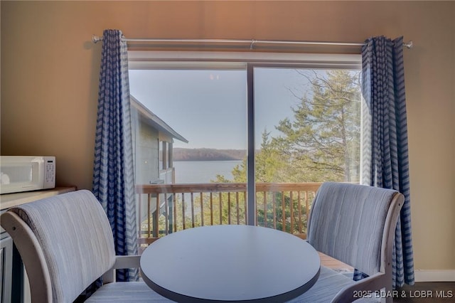 dining space with a water view