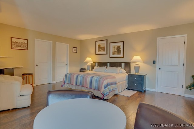 bedroom with hardwood / wood-style flooring